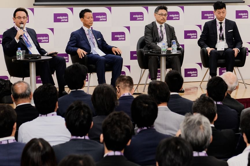 Christopher Dillon moderating a panel discussion at the MIPIM Japan conference in Osaka, Japan, in 2016