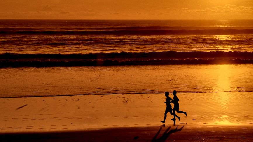 Joggers on the beach in Bali, Indonesia, 1995. Film scanning works best with high quality stock like Kodak Ektar.