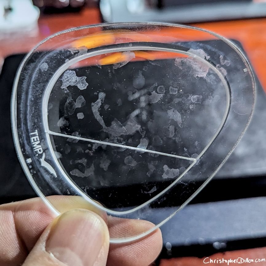Bifocal scuba lens with hard water stains